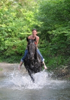 Fun in the river on horseback on <a href="http://www.adventureride.eu/en/select-dates/through_the_rivers_of_gauja_national_park/">horseback riding vacation</a> in Gauja national park